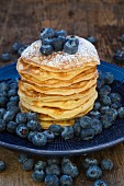 Pancakes with blueberries on plate
