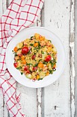 Couscous with colourful tomatoes, parsley, cucumber and red onion