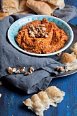 Muhammara (Levantine hot red pepper dip made from walnuts and red peppers) with turkish flatbread