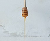 Honey dripping from a honey drizzler