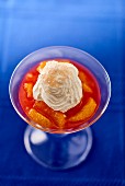Blood orange topped with cream and lemon caviar