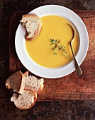 Pumpkin soup with bread and thyme