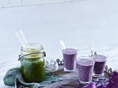 Goutweed and apple smoothie and a purple blueberry oat drink