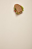 A ham, tomato, cucumber and lettuce sandwich