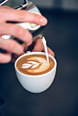 A barista doing latte art