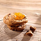 A stack of chocolate chip cookies with apricot jam