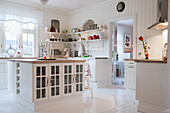 Island counter in white country-house kitchen