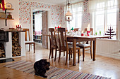 Dog lying on rug in rustic dining room