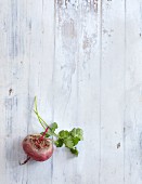 Raw beetroot on a white wooden background