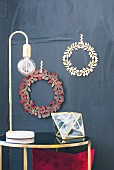 Hand-made craft paper Christmas wreaths on wall