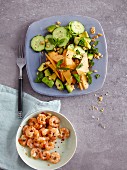 A melon, cucumber and avocado salad - 'Jump in the Pool' - and garlic prawns