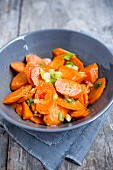 Carrot slices with spring onions