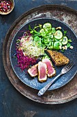 Dukka tuna with sprouts and cucumber salad