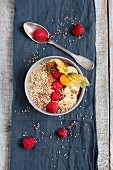 A cacao smoothie bowl with raspberries, banana and popped amaranth