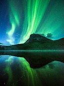 Aurora borealis over a mountain