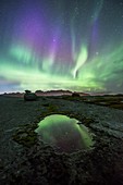 Aurora borealis over a pool