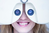 Eye examination of woman