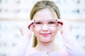 Girl trying on glasses