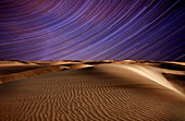 Star trails in the sky above the desert