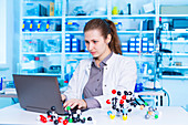 Scientist using laptop in the laboratory