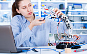 Female engineer working in a robotics laboratory