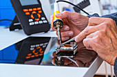 Person soldering an electronic component