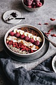 An acai smoothie bowl with fruit, goji berries, and coconut chips (superfoods)