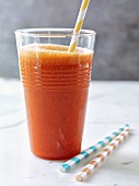 Orange Sunrise in a glass with a straw
