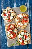 Pizzas with vegetables, mozzarella and basil sauce