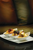 Grits Flight: stone-ground yellow grits topped with oyster and hollandaise, braised short rib and pimiento cheese with prosciutto
