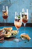 Fig prosecco with mint served with prawn tramezzini
