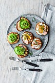 Blinis with pulled salmon and wasabi peas