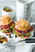 Veggie burgers with cheese patties, grilled vegetables, and corn and bean salad