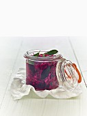Lacto fermented red cabbage with bay leaves in a mason jar