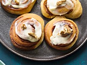 Cinnamon Rolls: cinnamon rolls topped with fresh cheese and walnuts