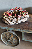 Wreath of burl wood and crab apples on trolley