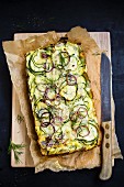 Courgette bake with gouda and red onions
