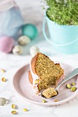 Slice of a Polish Easter cake with pistachios