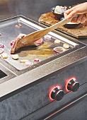 A modern hob for gentle, low-fat frying, grilling and warming