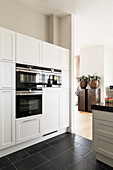 Fitted appliances in elegant white kitchen