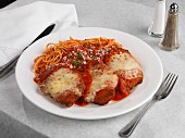 Chicken breasts with ham and cheese, baked in tomato sauce, served with spaghetti