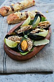 Mussels with rice and lime wedges