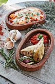 Stuffed squid and a seafood bake in serving bowls