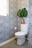 Guest toilet with blue and white ornamental wall tiles