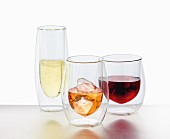 Double-walled cooling glasses containing alcoholic drinks