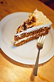 A slice of carrot cake with walnut