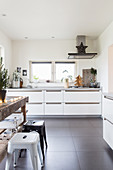 Festive decorations in white modern kitchen with grey floor tiles