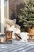 Comfortable seating area and brazier on wintry terrace