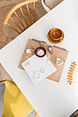 Notebook, finds and knick-knacks on dining table
