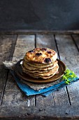 Traditional American pancakes with berries and maple syrup